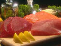 a plate of sashimi