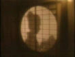 a woman behind a screen