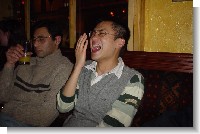 Chau laughing, sarv drunk in the corner