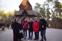 Some happy tourists outside a viking-christian church.